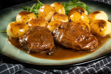 Sticker - Traditional German braised pork cheeks in brown sauce.