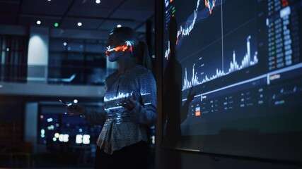 Wall Mural - Business Conference Meeting Presentation: Businesswoman does Financial Analysis talks to Group of Businessspeople. Projector Screen Shows Stock Market Data, Investment Strategy, Revenue Growth