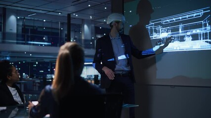 Real Estate Architectural Conference Meeting. Portrait of Chief Architect Presenting Building Construction to Investors. Projector TV Screen in Dark Room Shows 3D Model of Sustainable Housing Project