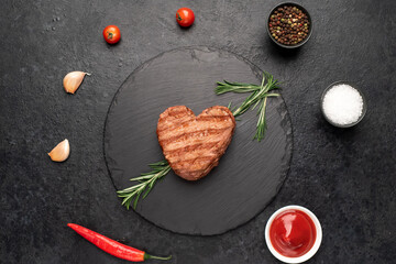 Wall Mural - Heart shaped grilled beef steak with arrow for valentine's day on stone background