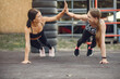 © hetmanstock2 - Sports girls training in a summer park