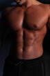 © alones - Athletic sexy healthy body of young strong man athlete trainer with naked torso in the dark