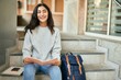 © Krakenimages.com - Young middle east student girl smiling happy reading book at the university.