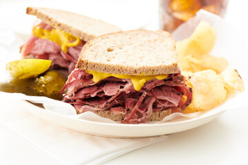 smoked meat - pastrami, corned beef - sandwich with pickle