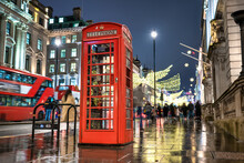 Red Telephone Booth In London During Christmas Season. England