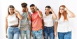 © Krakenimages.com - Group of young friends standing together over isolated background pointing unhappy to pimple on forehead, ugly infection of blackhead. acne and skin problem