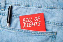 The Back Pocket Of Blue Jeans Contains A White Pen And A White Red Card With The Text Guide