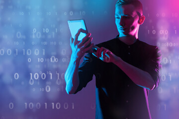 Computer techologies. Young man with tablet computer. Binary code as metaphor for software development. Web application developer. Guy on blue purple. Student studying programming concept