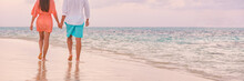 Luxury Romantic Caribbean Travel Vacation Getaway For Lovers Walking On Sunset Beach Stroll For Honeymoon Destination. Woman And Man Couple Holding Hands Going Away. Panoramic Banner