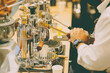 Cafe barista using manual lever espresso coffee extractor hand press machine classy style