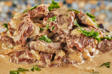 Sticker - Beef stroganoff on a plate and eating utensils. French gourmet cuisine