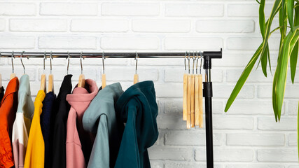 Women's, youth clothing on a hanger in different colors.