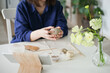 © Dina - woman sculpting a pumpkin out of clay with tools - hobby and DIY project at home