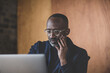 © ReeldealHD images - Male black business executive working at desk in office