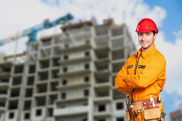 Wall Mural - Male engineer handsome man or architect looking construction with safety helmet