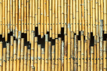 Old Brown Tone Bamboo Simple Wall Or Bamboo Fence Texture Background For Interior Or Exterior Design Vintage Tone. Brown Bamboo Stick Pattern Backdrop. Local Area Urban House Protection From Thief.