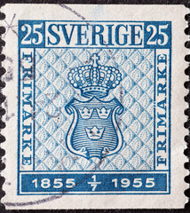 Wall Mural - Sweden - circa 1955: a postage stamp from Sweden showing a coat of arms on a First Swedish postage stamp design