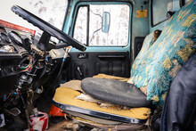 Interior Of An Old Truck With A Broken Seat
