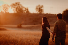 Couple Walking In The Sunset