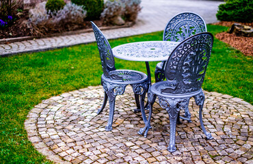 Canvas Print - old chairs at a backyard