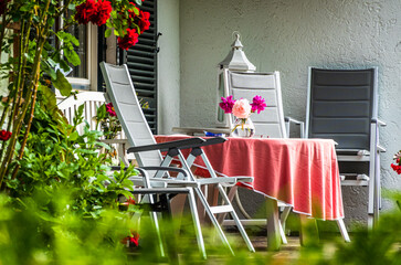 Canvas Print - old chairs at a backyard