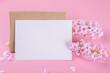 Blank wedding invitation stationery card mockup with envelope on pink background with hyacinth flowers and pink heart, 5x7