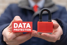Data Protection And Privacy Concept. Information Security. Man Holding A Red Closed Padlock And Red Block With Data Protection Text.