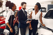 © prostooleh - Two stylish black woman in a car salon