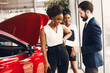 © prostooleh - Two stylish black woman in a car salon