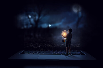 Wall Mural - Boy with a glowing light bulb