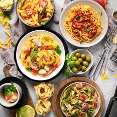 Canvas Print - Pasta assortment on gray background.