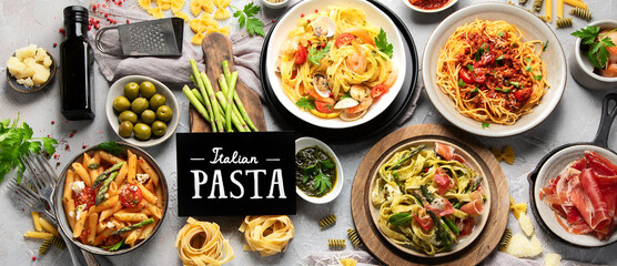 Canvas Print - Pasta assortment on gray background.