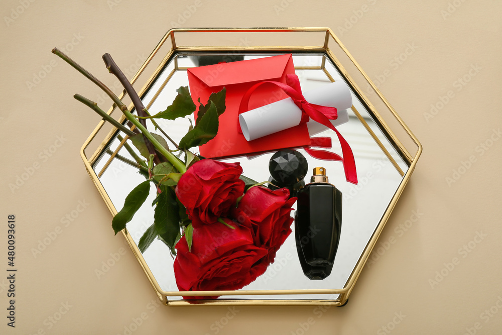 Tray with perfume and roses for Valentine's day on beige background