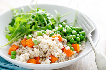 Sticker - Barley porridge with green peas, baked pumpkin and fresh arugula salad