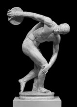 Discus Thrower Discobolus Statue. A Part Of The Ancient Olymp Games. A Roman Copy Of The Lost Bronze Greek Sculpture. Isolated On Black Background