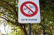 prohibition sign with french text sur le trottoir means on the sidewalk electric vehicles bicycle scooter forbidden