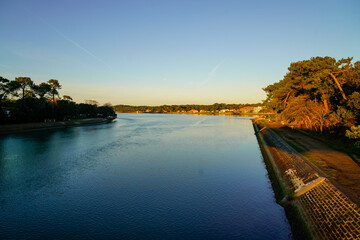 Wall Mural - Hossegor lake with blue calm water in landes france