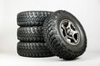 suv wheels are on a gray background.  set of mud wheels, studio shot. off-road tires close up