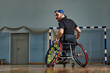 © Georgii - young man with a physical disability playing tennis on wheelchair on tennis court