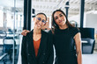 © Jacob Lund - Female colleagues standing together in an office