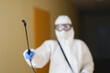 © H_Ko - Disinfection specialist with spray bottle, close-up
