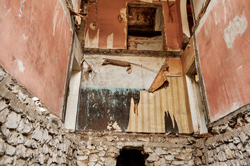 Wall Mural - The interior of an abandoned crumbling building. A dying city. Frightening atmosphere