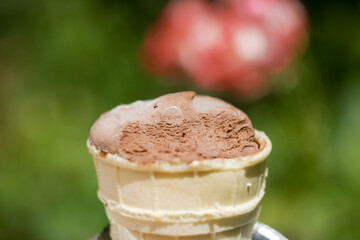 Wall Mural - Delicious chocolate ice cream with teeth marks in waffle cup