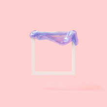 Square Frame With Violet Slime On Top On A Pastel Pink Background. Retro Futuristic Conceptual Background.