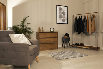 Wall Mural - Modern dressing room interior with stylish clothes, shoes and decorative elements