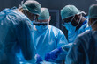 © Acronym - Multiracial team of professional medical surgeons performs the surgical operation in a modern hospital. Doctors are working to save the patient. Medicine, health, cardiology and transplantation.