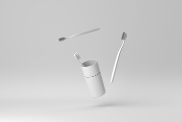 Wall Mural - The toothbrushes in a glass on white background. minimal paper concept. 3D render.