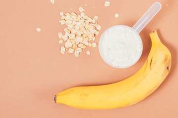 Wall Mural - Healthy breakfast protein powder next to fresh banana