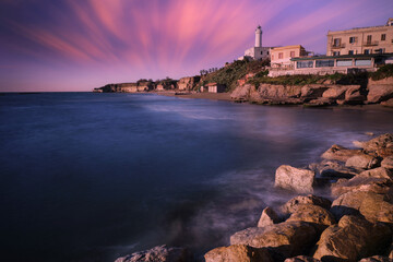 Wall Mural - long exposure of the coast of anzio with the lighthouse