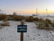 A Keep Out Sign Seen Near Driftwood Beach On Jekyll Island Is Posted To Allow For Habitat Restoration.